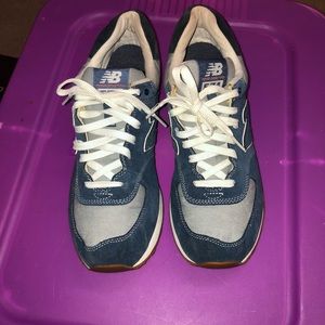 Gently worn men’s jean blue new balance sneakers.